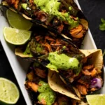 Jerk Salmon Tacos with Avocado Cilantro Lime Sauce