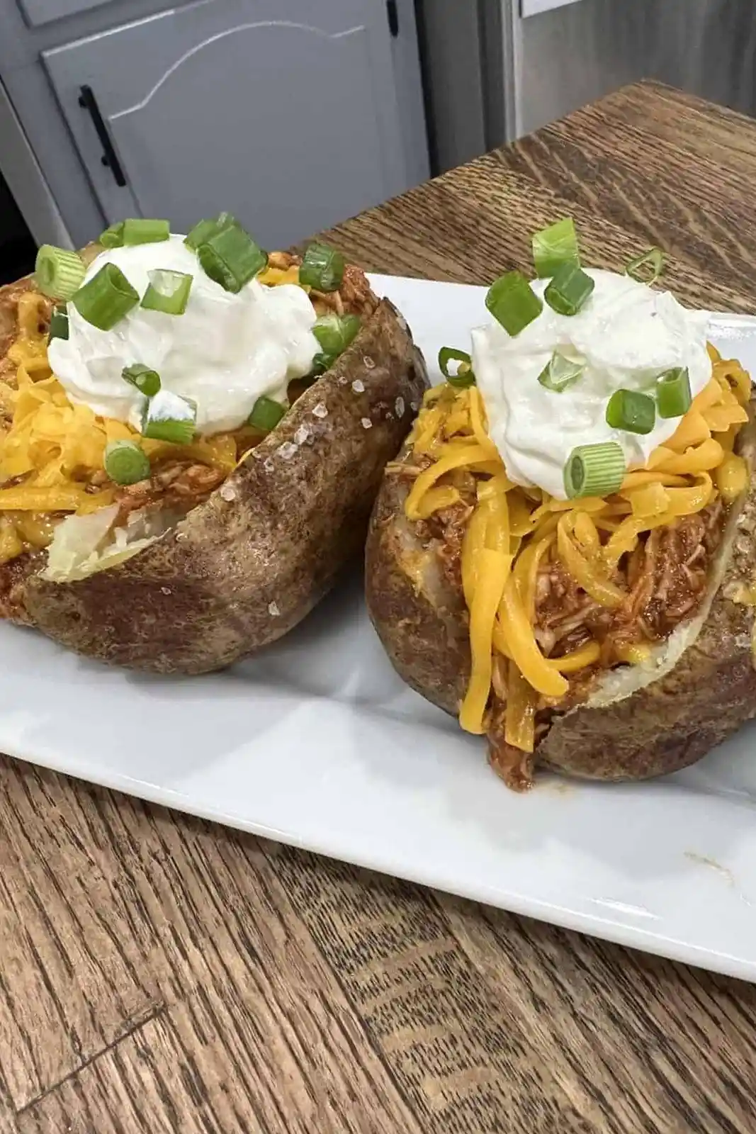 Slow Cooker Shredded BBQ Chicken Stuffed Potatoes
